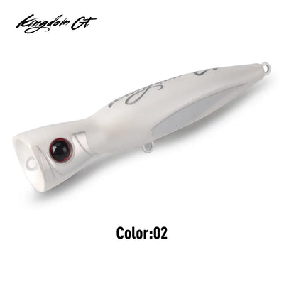 White popper fishing lure with black eye and side hook
