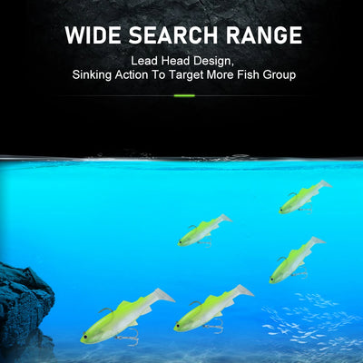 Green paddle-tail soft swimbait lure with treble hooks shown swimming underwater