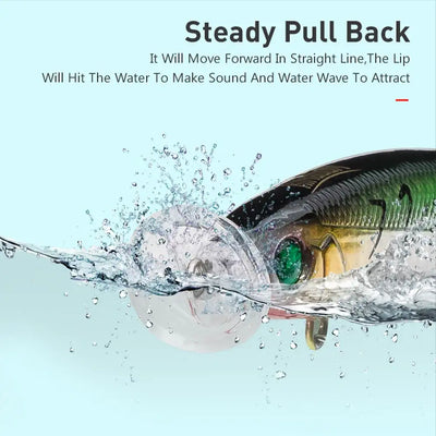 Floating lure with green eye and blue back, splashing water near treble hooks