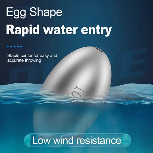 Silver egg-shaped fishing sinker partially submerged, rounded water-entry profile