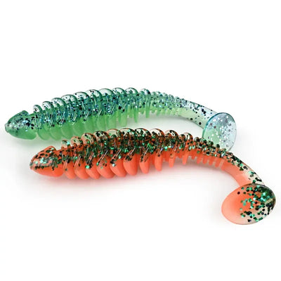 Green-and-orange paddle T-tail soft plastic lure with speckled paddle tip