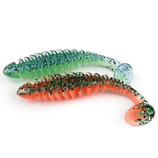 Green-and-orange paddle T-tail soft plastic lure with speckled paddle tip