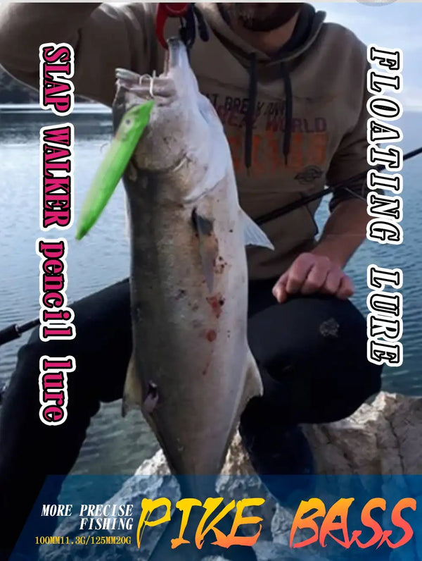 Bass fishing photo featuring a green lure and a caught fish on a rocky shore