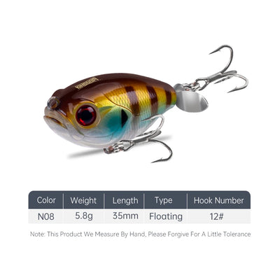 Floating topwater lure, brown-gold striped body with red eye and silver treble hooks