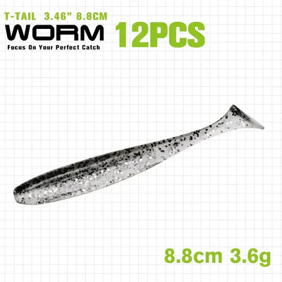 T-tail shad soft plastic lure, dark gray/black with silver speckles