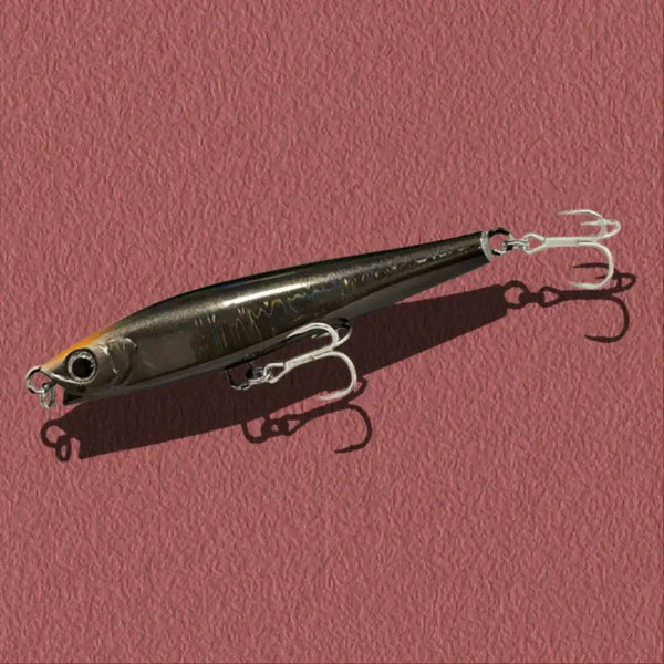 Dark gray lipless minnow fishing lure with silver treble hooks