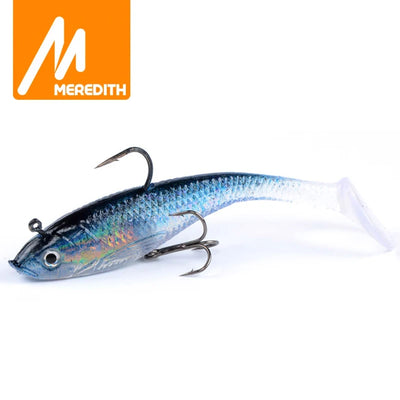 Blue iridescent soft fishing lure with treble hooks, 10cm long