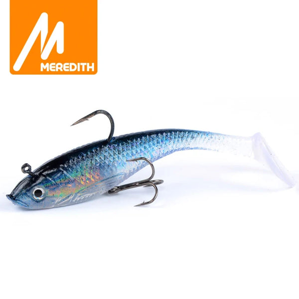 Blue iridescent soft fishing lure with treble hooks, 10cm long