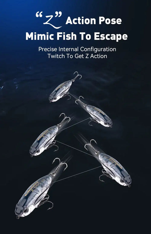 Blue-gray topwater pencil fishing lure set in an action pose, with treble hooks