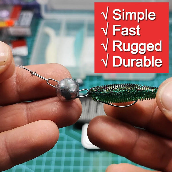 Ball sinker hook clip attached to a soft plastic lure with metal hook and prongs
