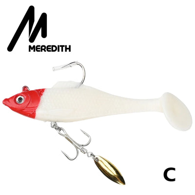 White soft plastic swimbait lure with red head, gold spinner blade, and hooks