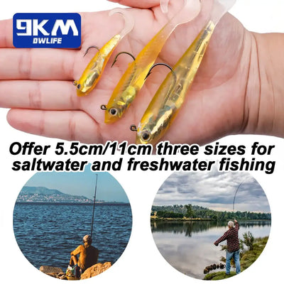 Three gold/yellow paddle-tail swimbait lures with jig heads held in hand