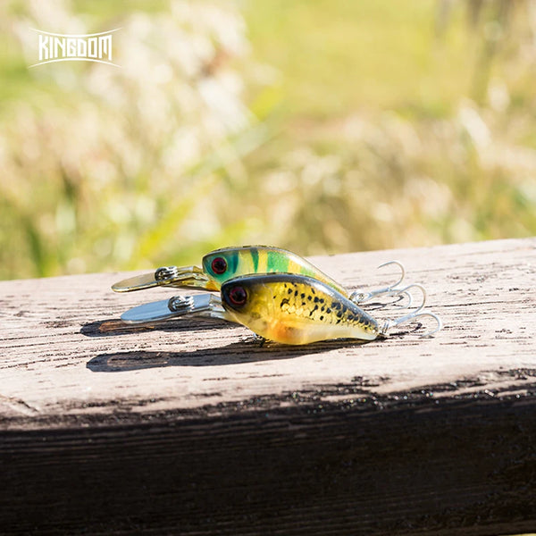 Yellow-speckled crankbait minnow lure with gold body, silver lip, and treble hooks.