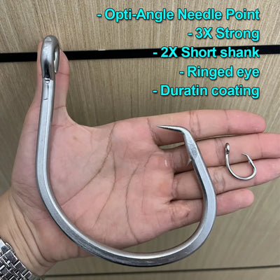 Stainless steel circle hook in hand, short shank with ringed eye and needle point