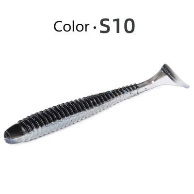 Soft paddle-tail swimbait lure, dark gray with translucent body and ribbed texture (Color S10).