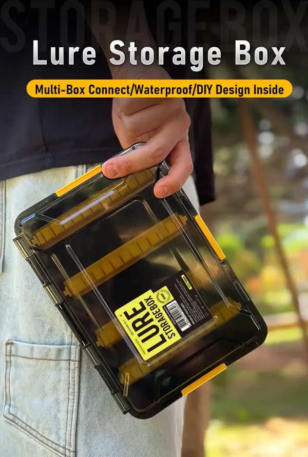 Amber lure storage box with yellow latch, held in hand with translucent lid