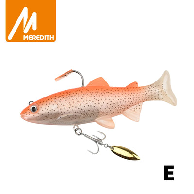Soft swimbait lure in orange speckled back and cream belly, spinner blade treble hook