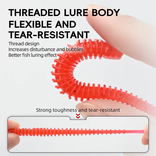 Red threaded-body paddle-tail swimbait with flexible textured segments, close-up hold