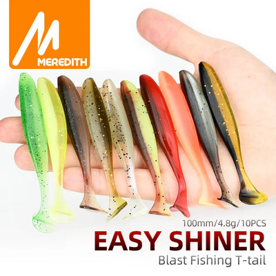 Assorted silicone T-tail fishing lures, multicolor set shown in a hand