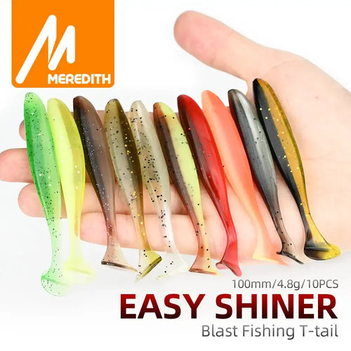Assorted silicone T-tail fishing lures, multicolor set shown in a hand