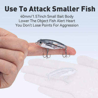 Floating pencil stickbait lure held in hand, silver-blue body with treble hooks
