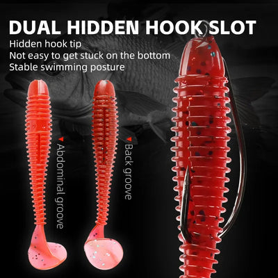 Red soft fishing lures with paddle tail, showing hidden hook slot detail.