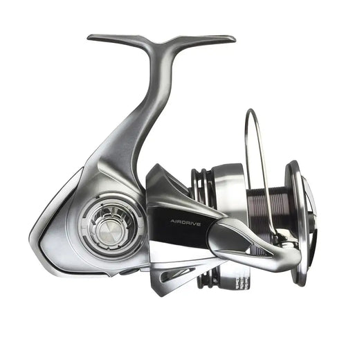 Silver spinning fishing reel with side drag knob and bent handle, angled view