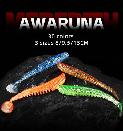 Assorted soft shad fishing lures in blue, orange, green, and pink colors