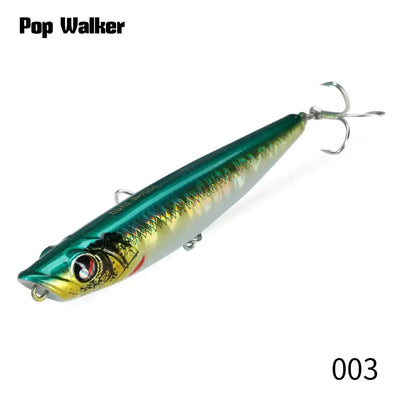 Green and silver popper fishing lure with treble hooks, glossy hard bait