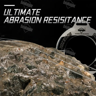 SeaKnight NT40 nylon fishing leader line on rocky abrasion test surface beside spool