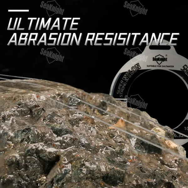 SeaKnight NT40 nylon fishing leader line on rocky abrasion test surface beside spool