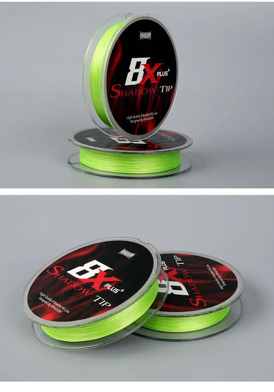Green braided fishing line spool with extra coils, two reels shown