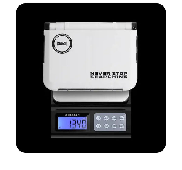 KINGDOM mini fishing tackle box storage case, white hinged lid closed on a digital scale