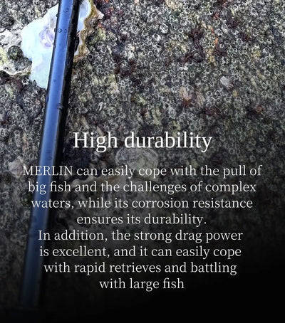 Spinning reel and fishing rod on rocks with green line spool