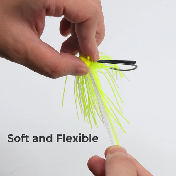 Neon yellow silicone skirt weedless jig lure held by fingers, black hook visible.