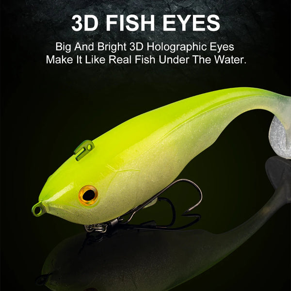 Soft T-tail sinking lure with 3D fish eyes, yellow-green body and clear white tail fin