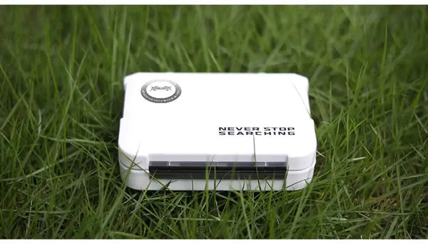 KINGDOM mini fishing tackle box storage case, white lid with logo, outdoors on grass