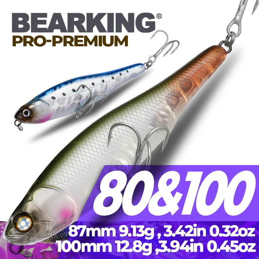 Topwater pencil lures with blue-and-purple and orange-green fish patterns and treble hooks