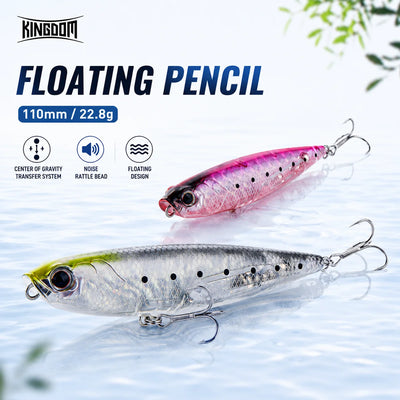 Floating fishing lure pencil bait with silver-gray body and pink accents, double hooks.