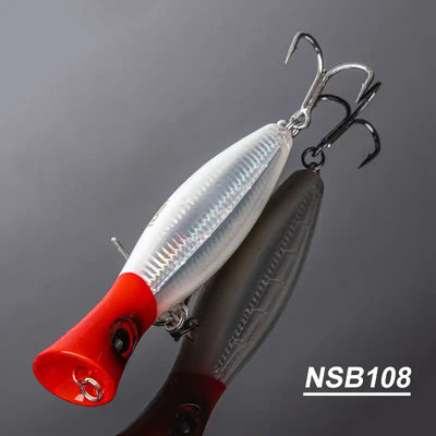 White and red topwater popper hard bait with treble hooks