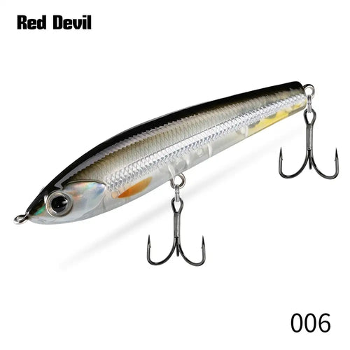 Topwater pencil fishing lure, silver with dark top and multiple treble hooks.