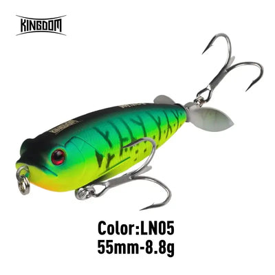 Green topwater pencil lure with silver propeller tail and red eye, double treble hooks