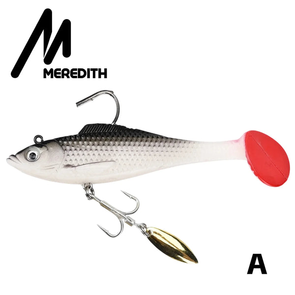 Silver-gray soft plastic swimbait lure with black back, red tail, and spinner blade