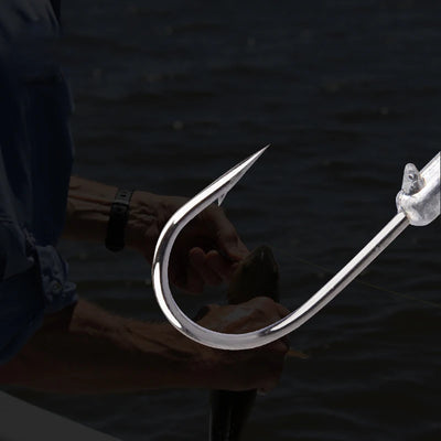 Large jig head fishing hook, silver metal, long shank with sharp barbed point