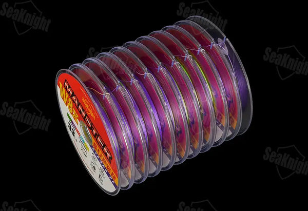 Multicolor PE fishing line on a spool, purple blue green and red strands