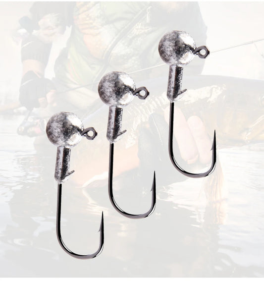 Three round ball jig heads with curved hooks, speckled silver balls