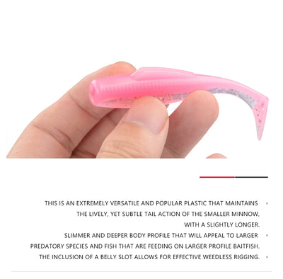 Pink soft plastic paddle tail minnow with speckled glitter finish, curved tail