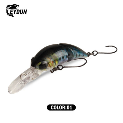 Floating minnow crankbait lure, blue-green patterned body with clear silver belly, two treble hooks