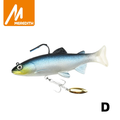 Soft swimbait lure with blue-gray body and yellow belly, gold spinner blade and treble hook