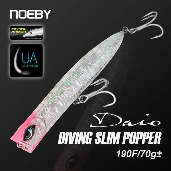 Iridescent silver-blue slim popper fishing lure with pink head, dual treble hooks